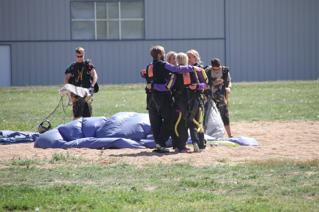 We siblings embraced in a joyful and adrenalin filled hug moments after we all landed safely.   